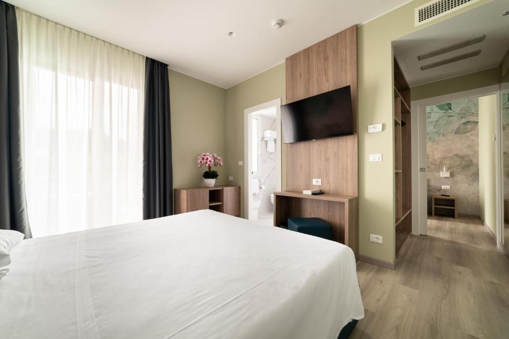 TV a/nebo společenská místnost v ubytování Hotel Colombo