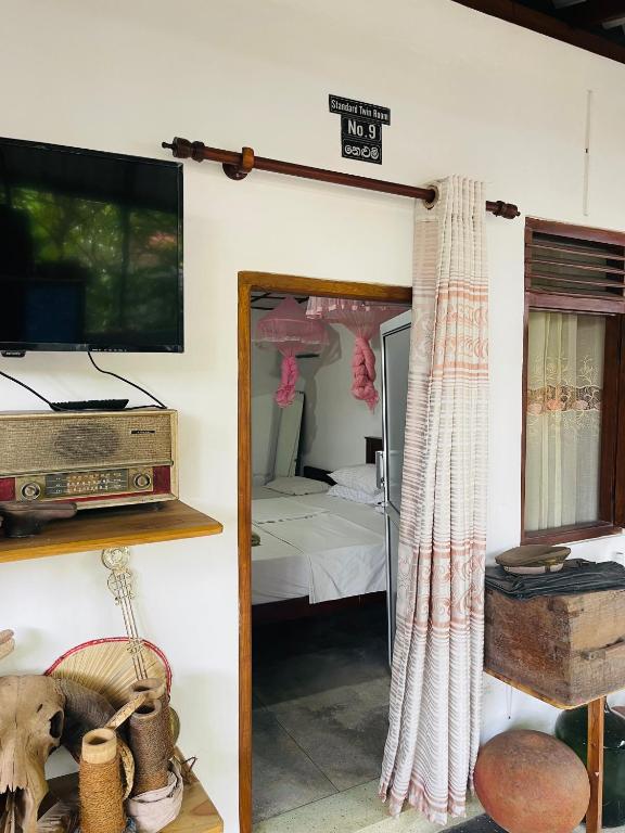 Postel nebo postele na pokoji v ubytování Mangala Lodge