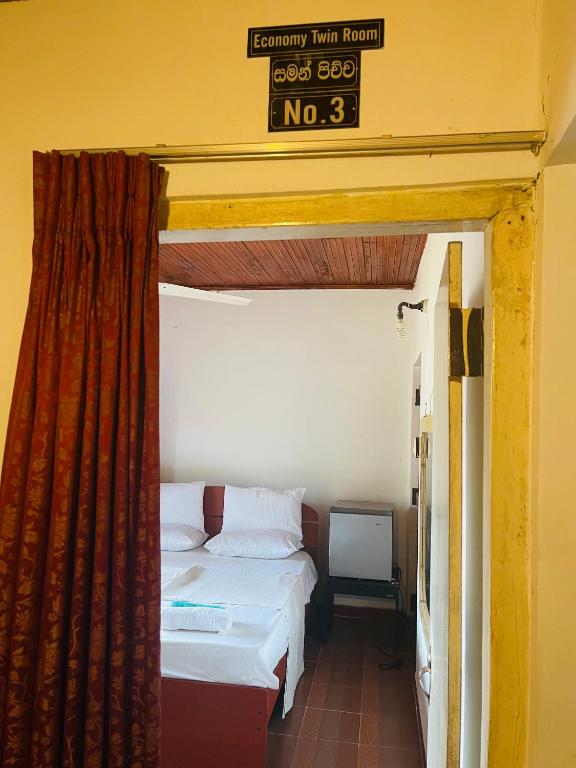 Postel nebo postele na pokoji v ubytování Mangala Lodge
