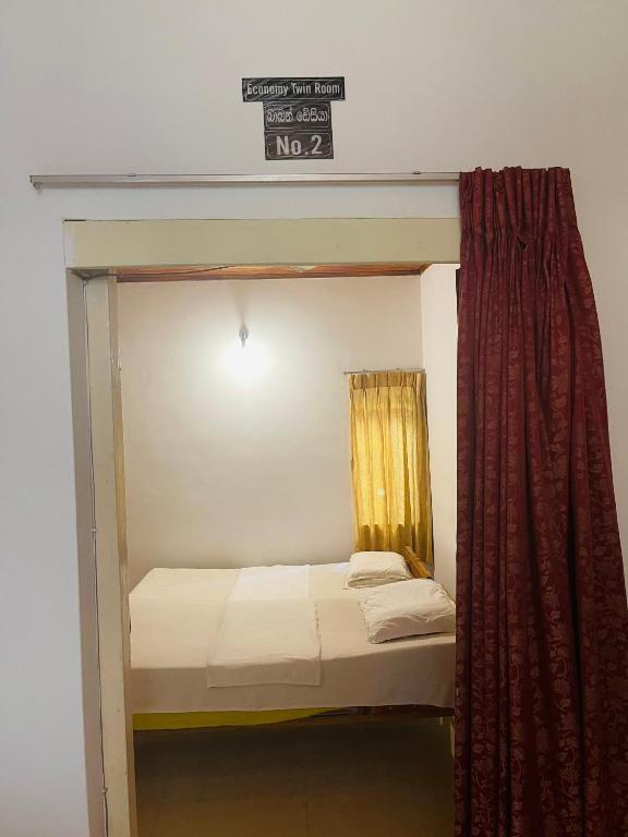 Postel nebo postele na pokoji v ubytování Mangala Lodge
