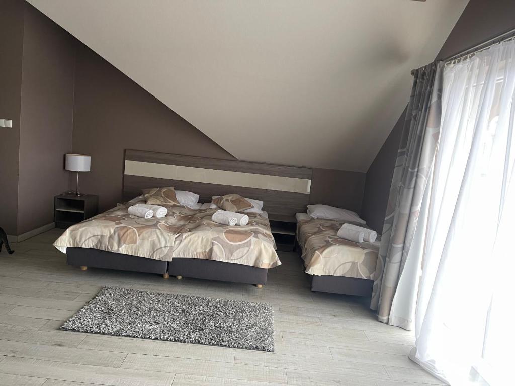 Posteľ alebo postele v izbe v ubytovaní Apartament Tignes Czarna Góra