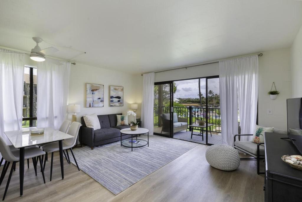 a living room with a couch and a table at Pono Kai H204 condo in Kapaa