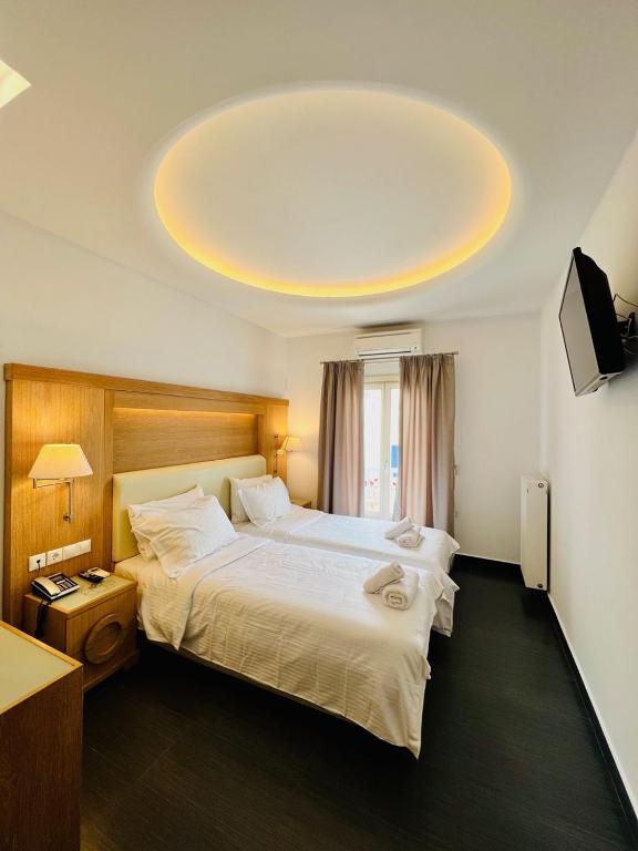 Postel nebo postele na pokoji v ubytování Matogianni Hotel