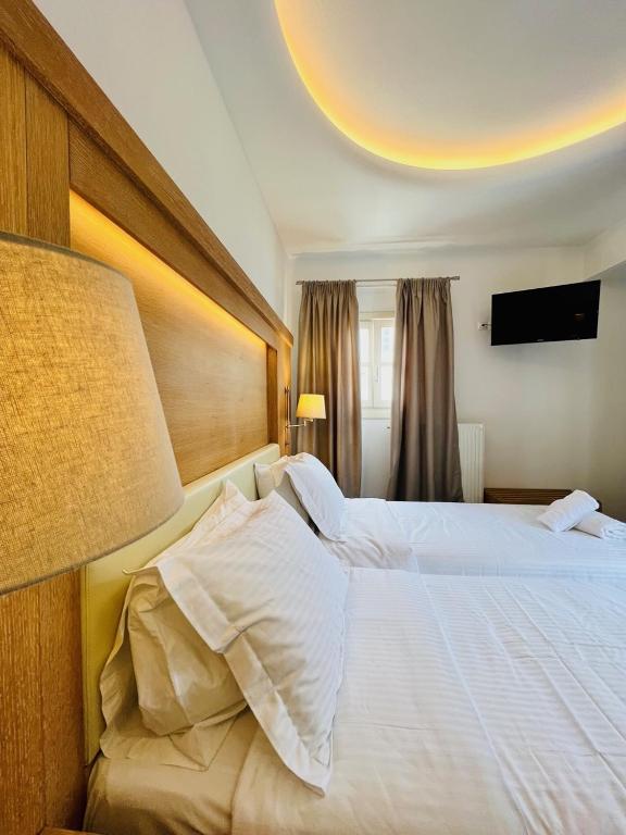 Postel nebo postele na pokoji v ubytování Matogianni Hotel