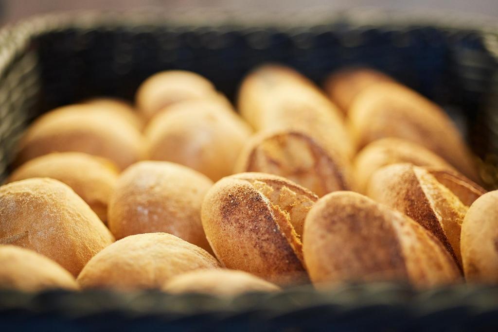 a bunch of donuts sitting in a basket at Akti Toroni Boutique Hotel in Toroni