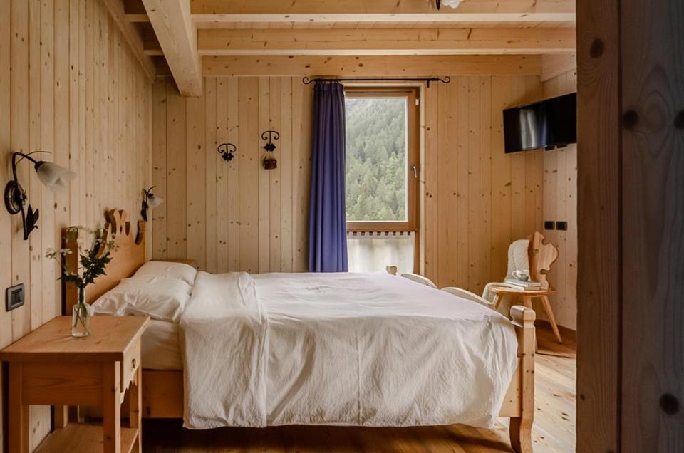 Postel nebo postele na pokoji v ubytování Hotel Chalet val di Rabbi