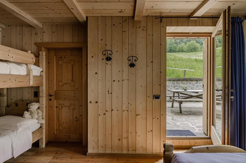 Postel nebo postele na pokoji v ubytování Hotel Chalet val di Rabbi