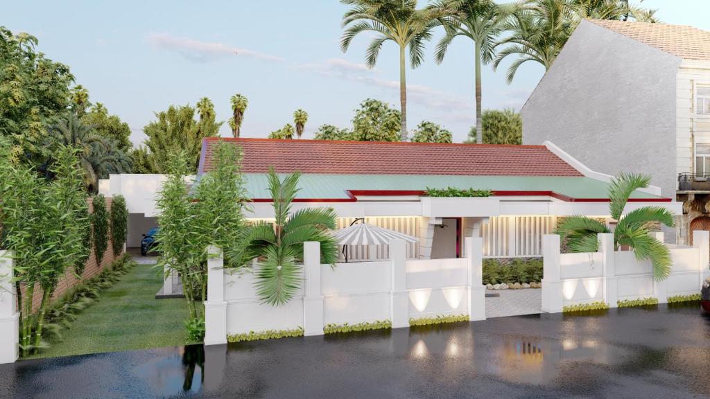 una representación de una casa con una valla blanca y palmeras en Villa Fernando Resort en Chilaw