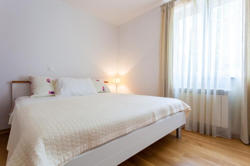 Łóżko lub łóżka w pokoju w obiekcie Apartments Svalina