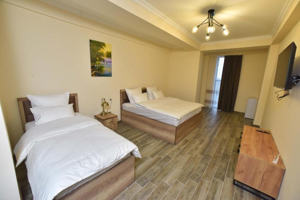 Postel nebo postele na pokoji v ubytování Altunyan Hotel