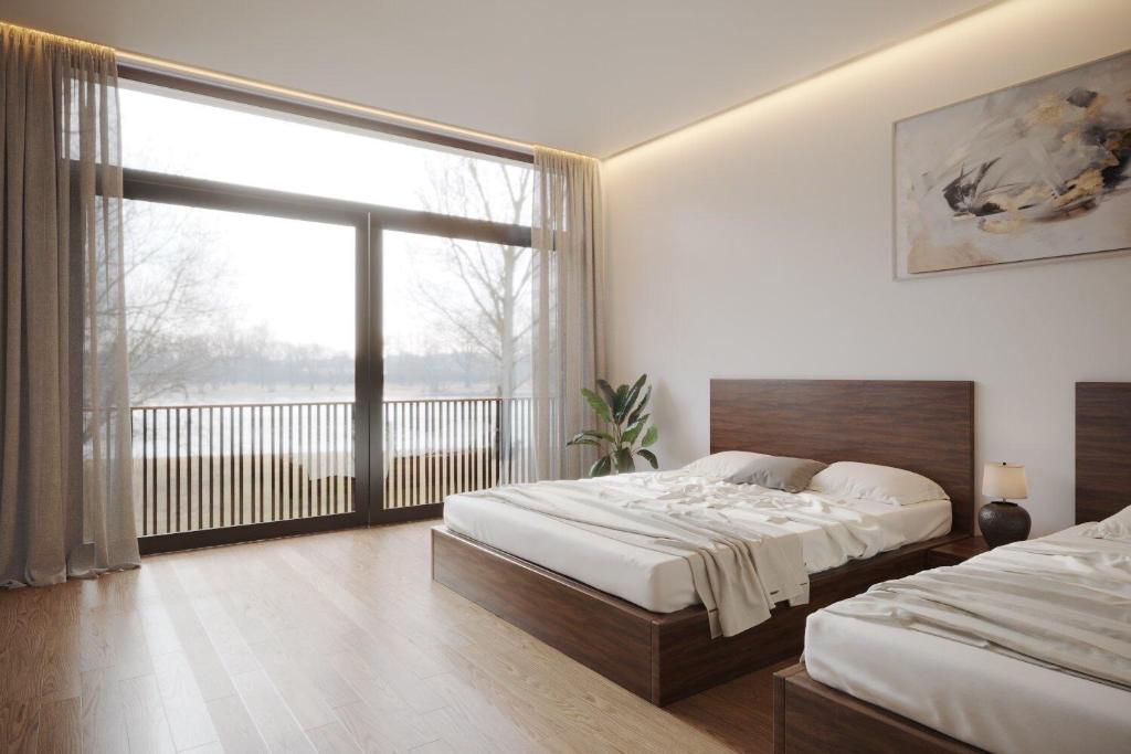 Кровать или кровати в номере Là Nhà Homestay Huế