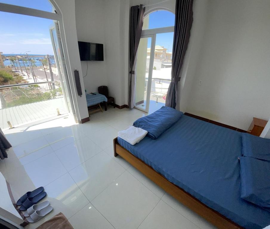 Giường trong phòng chung tại Homestay Hoài Tâm Phan Thiết