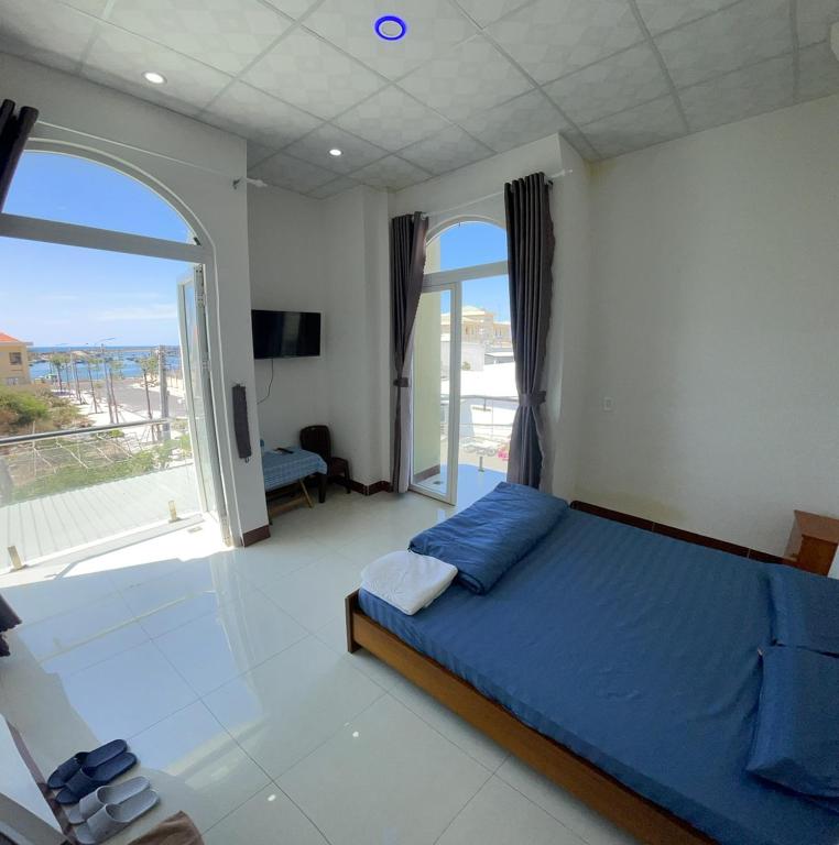 Giường trong phòng chung tại Homestay Hoài Tâm Phan Thiết