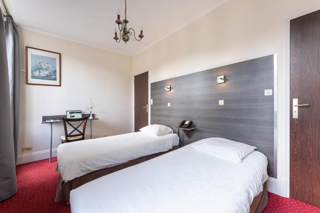 Postel nebo postele na pokoji v ubytování Hôtel du Helder