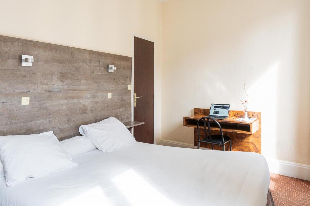 Postel nebo postele na pokoji v ubytování Hôtel du Helder