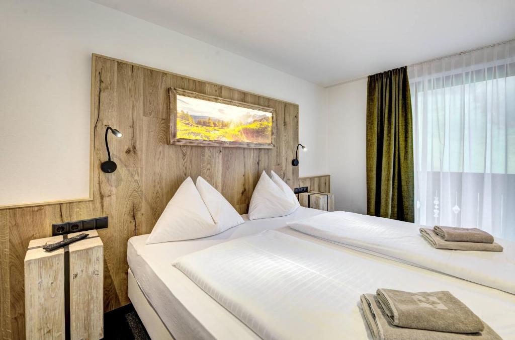 Кровать или кровати в номере Auszeit Filzmoos