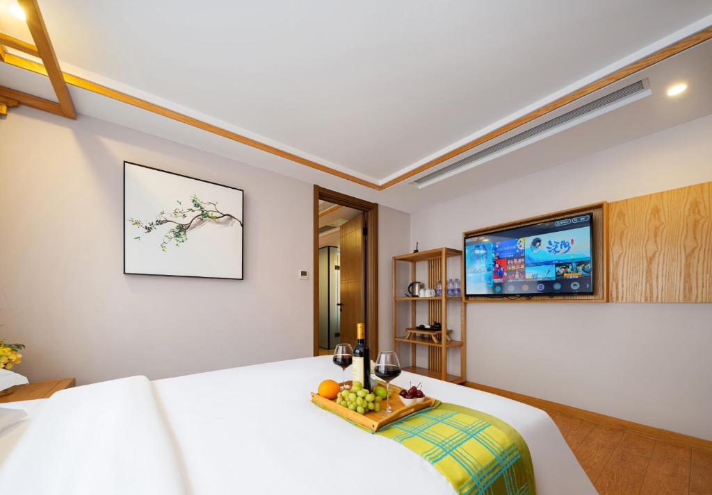 TV a/nebo společenská místnost v ubytování Xiangxi's Lovely - Yangyun Hotel