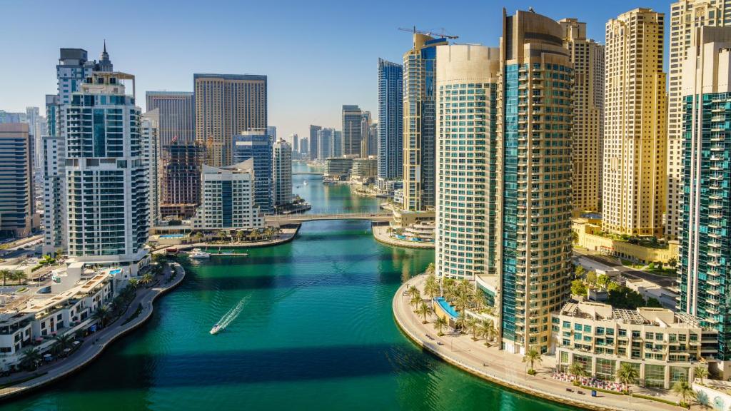 a view of a river in a city with tall buildings at FAM Living - Dubai Marina - Steps away from the beach in Dubai