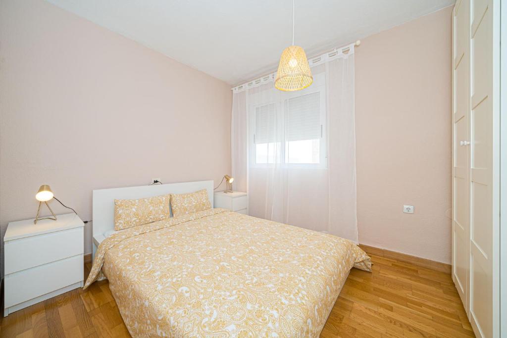 Postel nebo postele na pokoji v ubytování Casa Terra: Apartment 50 meters from the beach
