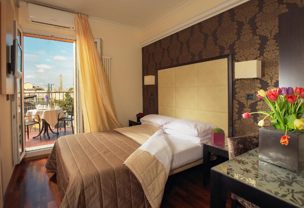 Postel nebo postele na pokoji v ubytování Hotel Touring