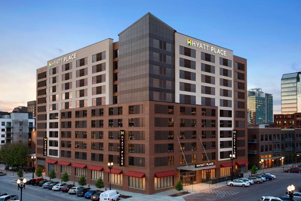 a rendering of a hotel building with a parking lot at Hyatt Place Omaha/Downtown-Old Market in Omaha