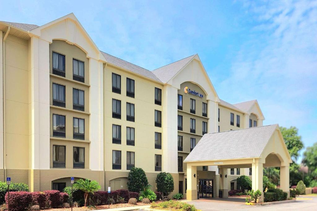 a rendering of a hotel building at Comfort Inn Pensacola - University Area in Pensacola