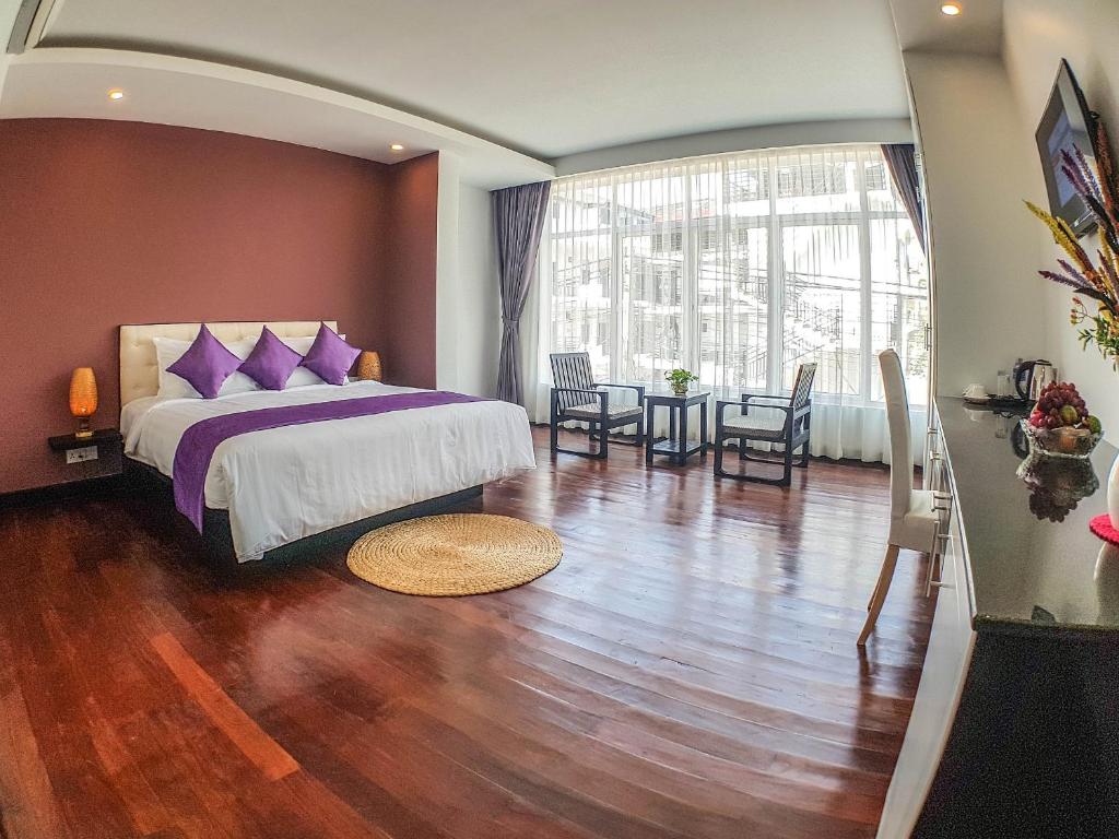 Postel nebo postele na pokoji v ubytování Hotel La Maravilla