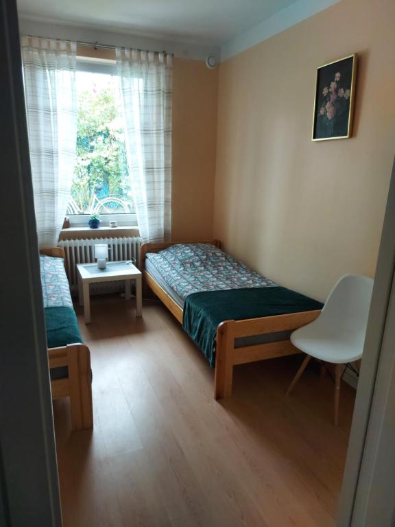 Posteľ alebo postele v izbe v ubytovaní Agroturystyka Jagoda