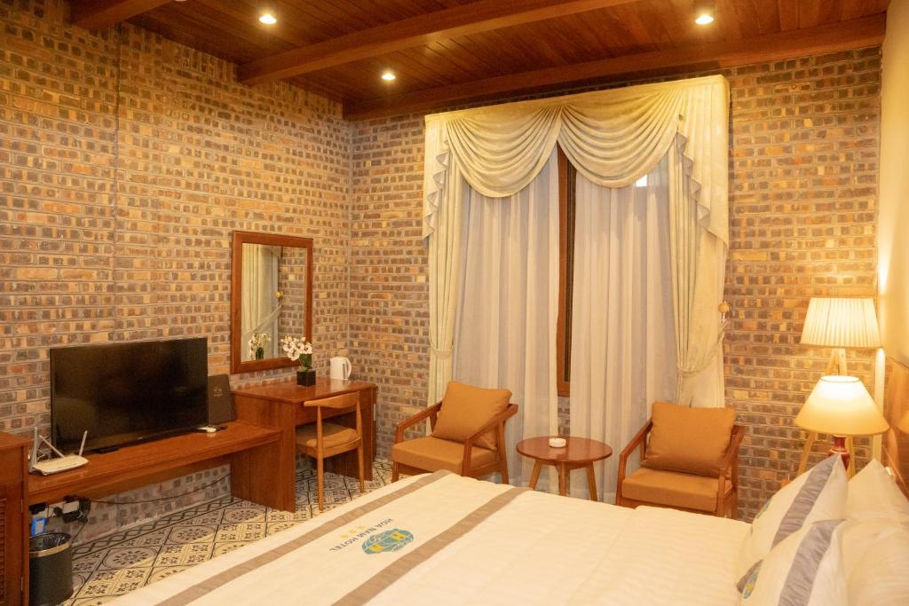 TV a/nebo společenská místnost v ubytování Hòa Nam Hotel