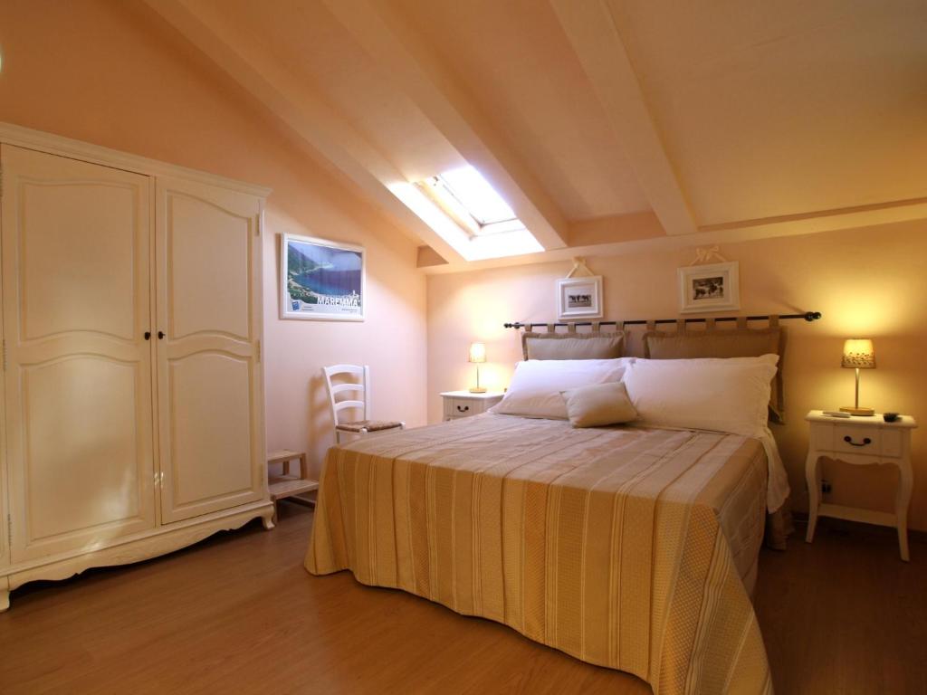 Postel nebo postele na pokoji v ubytování Agriturismo Peretti