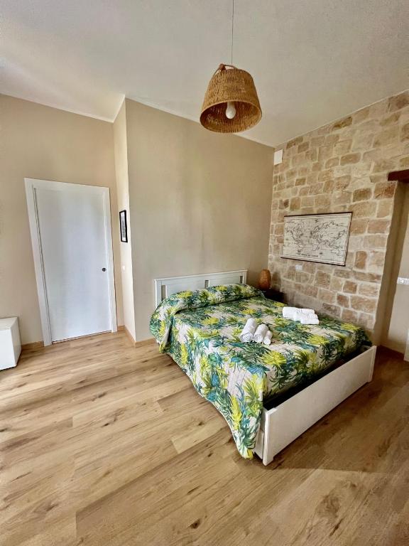 Postel nebo postele na pokoji v ubytování B&B Villa Dunardi