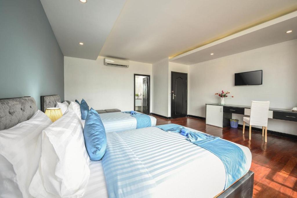 Postel nebo postele na pokoji v ubytování Hotel La Maravilla