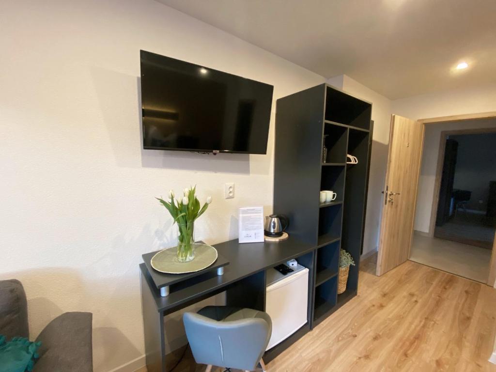 TV a/nebo společenská místnost v ubytování Vila LEMAR wellness & spa