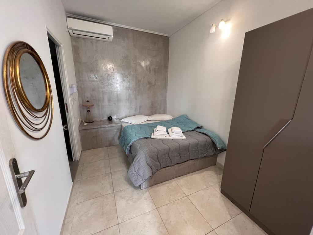 A bed or beds in a room at Birds Villa Apartments - Including Car Rental