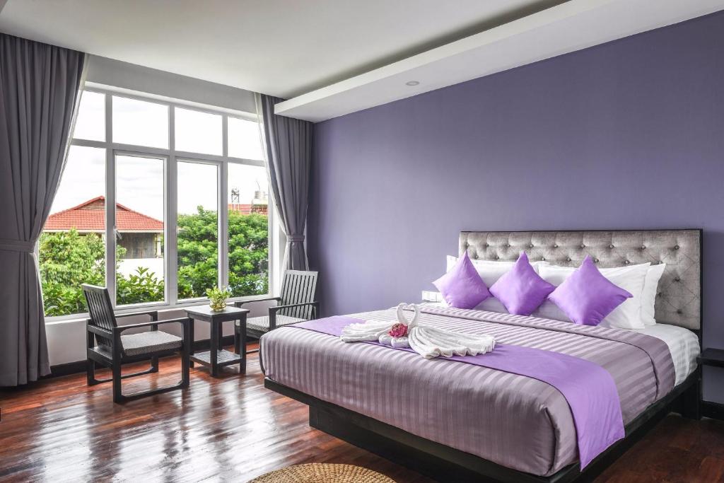 Postel nebo postele na pokoji v ubytování Hotel La Maravilla