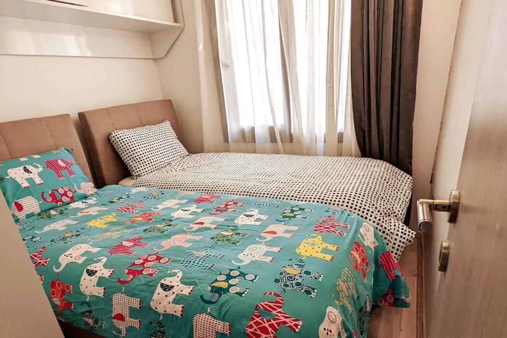 Ένα ή περισσότερα κρεβάτια σε δωμάτιο στο Sea Breeze Apartment