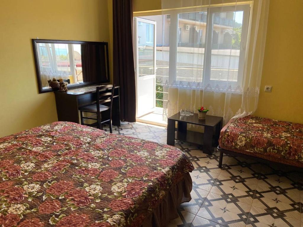 Un pat sau paturi într-o cameră la Park-hotel Abkhazia