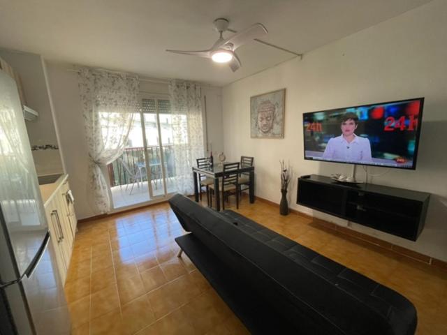 Televízia a/alebo spoločenská miestnosť v ubytovaní APARTAMENTO VACACIONAL