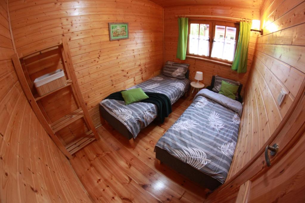 Postel nebo postele na pokoji v ubytování Oaza Dąbek