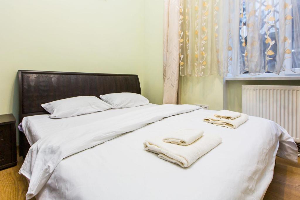 Ліжко або ліжка в номері Квартира подобово у центрі Львова вулиця Замарстинівська 5
