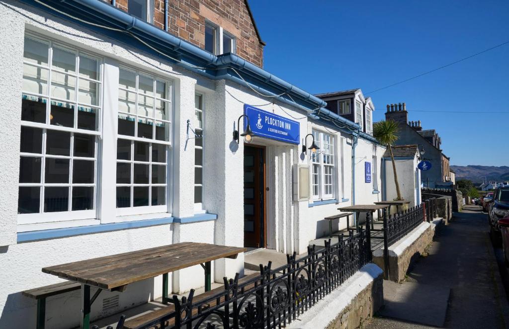 a couple of tables on the side of a building at Plockton Inn in Plockton