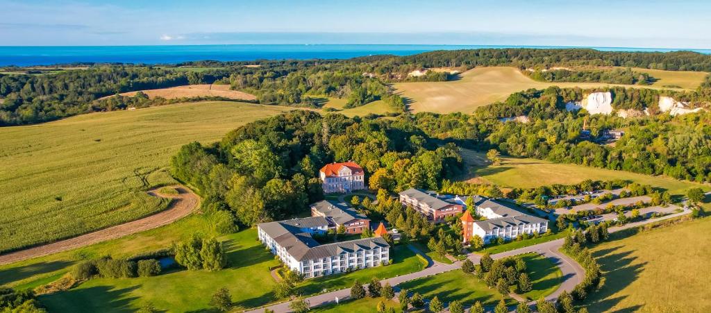 an aerial view of a large house in a field at Precise Resort Rügen & SPLASH Erlebniswelt in Sagard