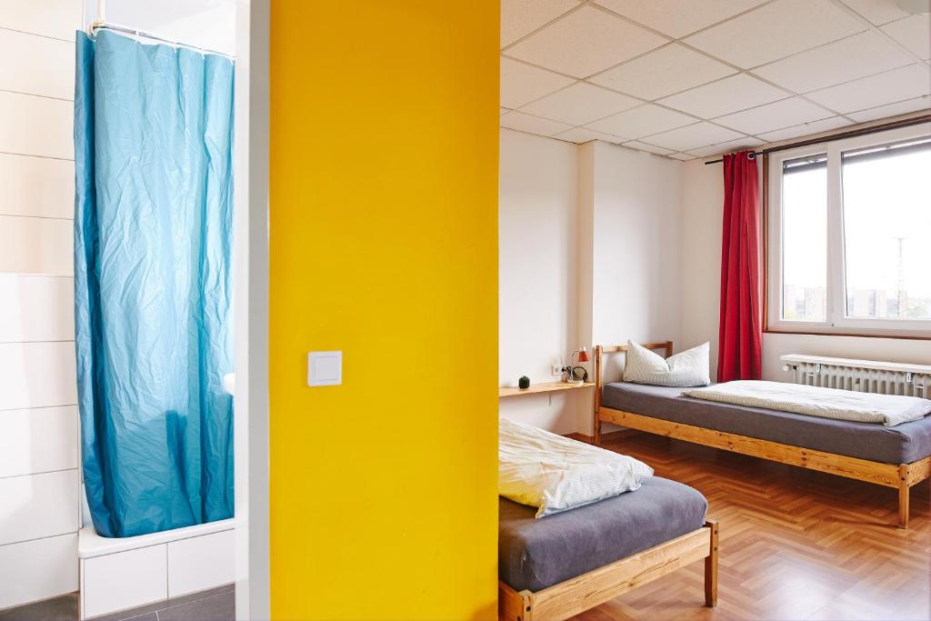 Postel nebo postele na pokoji v ubytování Sleep Station Hostel