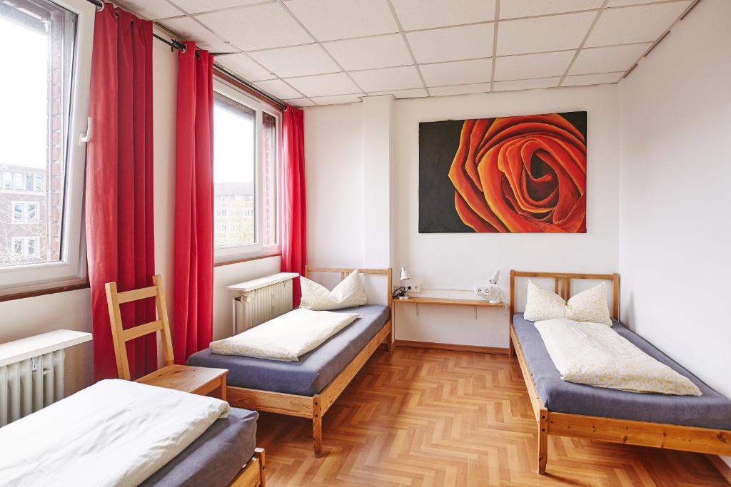 Postel nebo postele na pokoji v ubytování Sleep Station Hostel