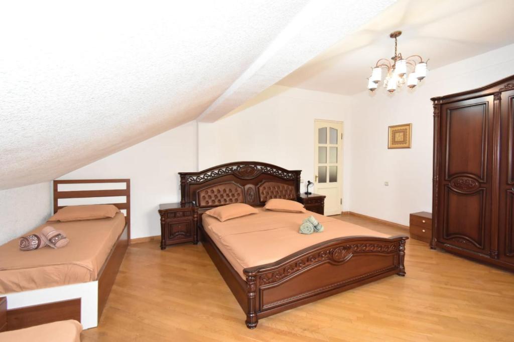 Postel nebo postele na pokoji v ubytování Guesthouses Opera