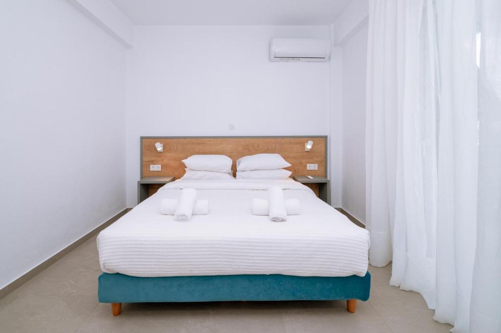 Postel nebo postele na pokoji v ubytování Danai & Palm Residential Complexes