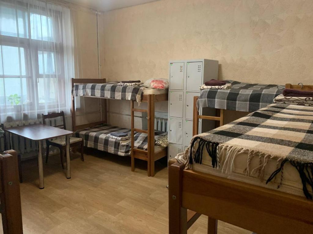 Postel nebo postele na pokoji v ubytování ВВ-ХОСТЕЛ