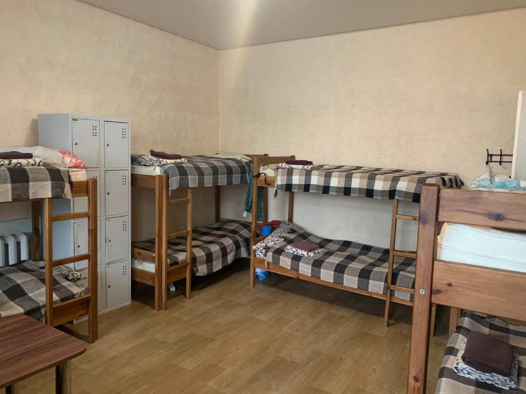 Postel nebo postele na pokoji v ubytování ВВ-ХОСТЕЛ
