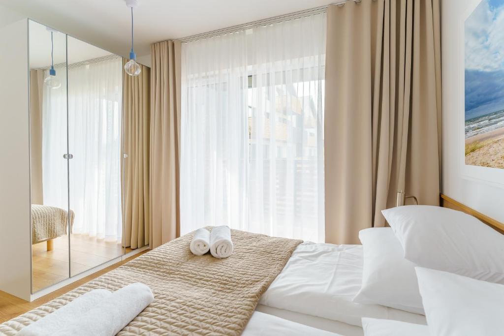 Posteľ alebo postele v izbe v ubytovaní Apartament DUNE SurfingBird Dźwirzyno
