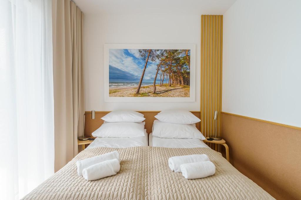 Posteľ alebo postele v izbe v ubytovaní Apartament DUNE SurfingBird Dźwirzyno